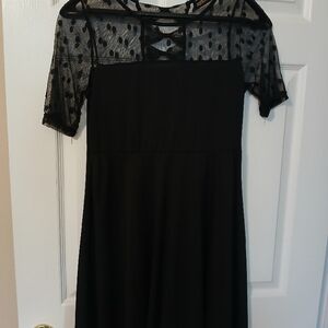 Elegant Black Dress with Sheer Polka Dot Sleeves